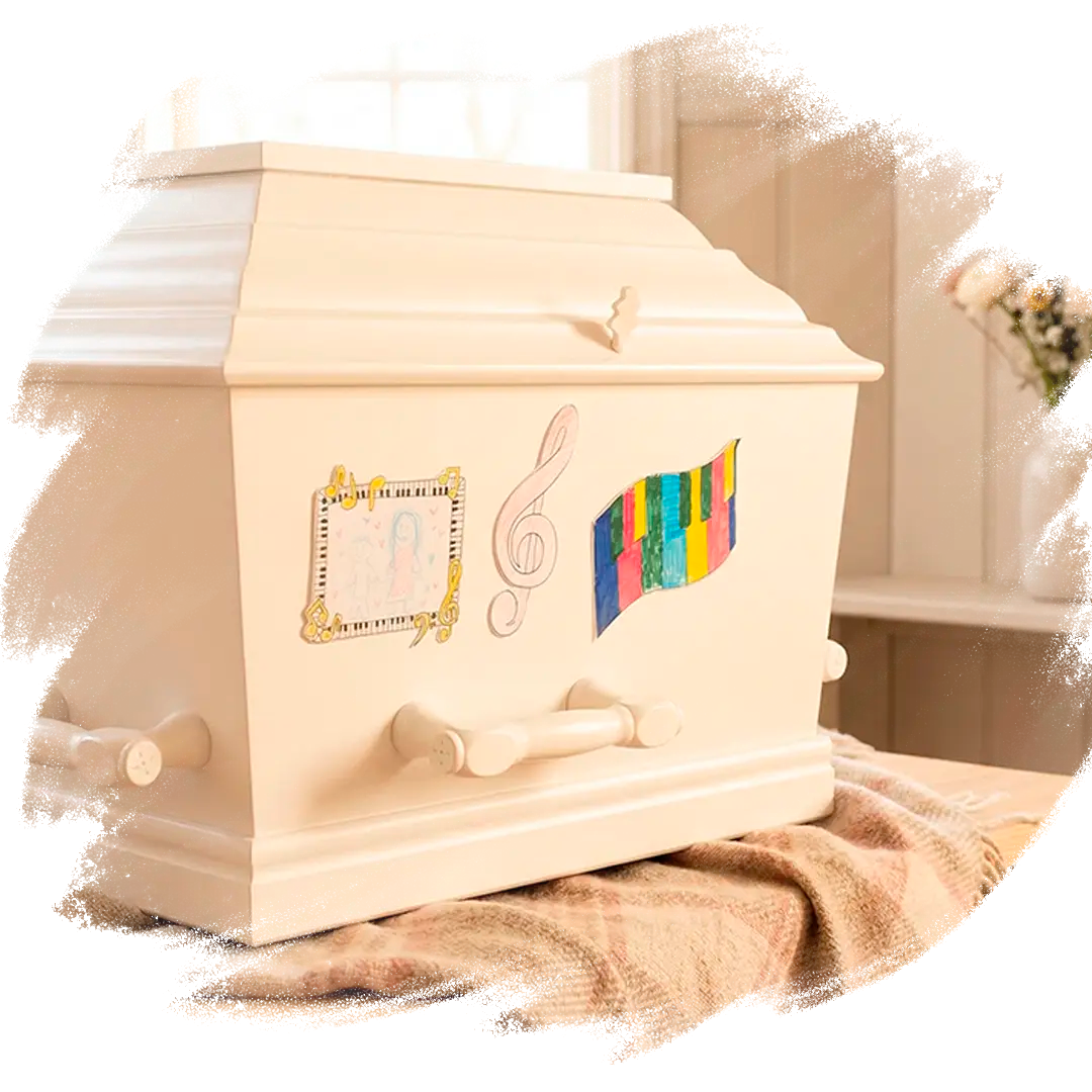 Tre farvelagte musikalske mindemærkater sat på en kiste. 